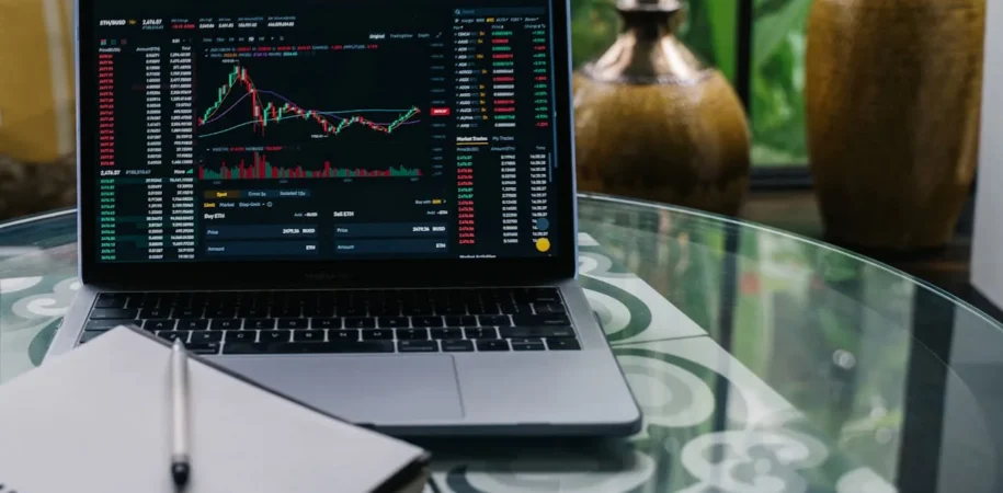 Laptop displaying stock market graphs related to real-time business performance